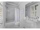 Bright bathroom featuring a shower/tub combo and a classic marble vanity at 325 Edwards Brook Ln, Canton, GA 30115