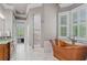 Stunning bathroom featuring a copper soaking tub, walk-in shower and marble floors at 325 Edwards Brook Ln, Canton, GA 30115