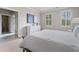 Bright bedroom featuring neutral walls, white furnishings, and two windows with natural light at 325 Edwards Brook Ln, Canton, GA 30115