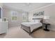 Bright bedroom featuring neutral walls, white furnishings, and two windows with natural light at 325 Edwards Brook Ln, Canton, GA 30115