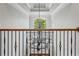 Grand foyer showcasing a decorative chandelier and a large window with treetop views at 325 Edwards Brook Ln, Canton, GA 30115