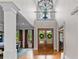 Grand foyer with soaring ceilings, hardwood floors, and a view of the second-floor balcony at 325 Edwards Brook Ln, Canton, GA 30115