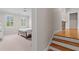 Hallway area featuring a bedroom on one side, and stairs to another area on the other side at 325 Edwards Brook Ln, Canton, GA 30115
