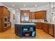 Gourmet kitchen with stainless-steel appliances, custom island, and dark wood cabinets at 325 Edwards Brook Ln, Canton, GA 30115