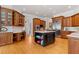 Large kitchen with custom wood cabinets and a dark wood island at 325 Edwards Brook Ln, Canton, GA 30115