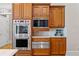 Gourmet kitchen featuring stainless steel appliances and custom wood cabinetry at 325 Edwards Brook Ln, Canton, GA 30115