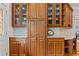 Kitchen cabinets with glass fronts for displaying dishware and convenient lower storage at 325 Edwards Brook Ln, Canton, GA 30115