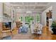 Elegant living room with coffered ceilings, fireplace, and views of the backyard at 325 Edwards Brook Ln, Canton, GA 30115