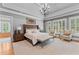 Luxury main bedroom suite with tray ceilings and large windows with shutter blinds at 325 Edwards Brook Ln, Canton, GA 30115