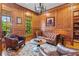 Warm and inviting wood-paneled office with leather furniture and elegant details at 325 Edwards Brook Ln, Canton, GA 30115