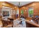 Sophisticated wood-paneled office with leather seating and natural light at 325 Edwards Brook Ln, Canton, GA 30115