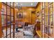 Elegant office with rich wood paneling, leather furniture, and custom built-ins at 325 Edwards Brook Ln, Canton, GA 30115