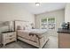 Comfortable bedroom with a view from the window, furnishings, and neutral tones at 359 Crider Ct, Woodstock, GA 30188