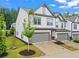 Beautiful townhome featuring an attached garage and professional landscaping at 359 Crider Ct, Woodstock, GA 30188
