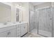 Luxurious main bathroom featuring a double vanity and a glass-enclosed shower with modern tile at 359 Crider Ct, Woodstock, GA 30188