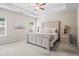 Spacious main bedroom with tray ceiling, neutral carpet, and decorative furnishings, illuminated by natural light from two windows at 359 Crider Ct, Woodstock, GA 30188