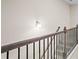 Classic staircase with dark wood railing and black iron spindles at 359 Crider Ct, Woodstock, GA 30188
