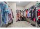 Organized walk-in closet with ample hanging space and shelving, ideal for wardrobe storage at 359 Crider Ct, Woodstock, GA 30188