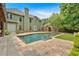 Beautiful backyard with green grass, pool, surrounding trees, and exterior view of the home at 3987 Tamarack Nw Dr, Kennesaw, GA 30152