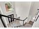 Open entryway with hardwood floors, view to living spaces, and modern chandelier at 3987 Tamarack Nw Dr, Kennesaw, GA 30152