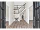Grand foyer featuring hardwood floors, a staircase, and an open layout, creating a welcoming ambiance at 3987 Tamarack Nw Dr, Kennesaw, GA 30152
