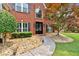 Close-up of the home's entrance, showcasing a stone pathway and well-kept landscaping at 3987 Tamarack Nw Dr, Kennesaw, GA 30152