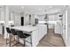 Modern kitchen with a large center island, white cabinets, stainless steel appliances, and bar stool seating at 3987 Tamarack Nw Dr, Kennesaw, GA 30152