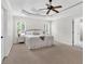 Large main bedroom boasting a decorative ceiling, two windows with blinds, and plush carpeting at 3987 Tamarack Nw Dr, Kennesaw, GA 30152