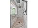 Modern walk-in shower features a pebble floor, a glass wall, and marble tile walls at 3987 Tamarack Nw Dr, Kennesaw, GA 30152