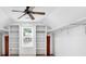 Walk-in closet featuring carpeted floors, custom white shelving and white walls at 3987 Tamarack Nw Dr, Kennesaw, GA 30152