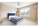 Bedroom with a blue bed, white carpet and a view of the back yard at 1489 Belmont Hills Dr, Suwanee, GA 30024
