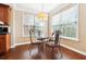 Cozy breakfast nook with large windows providing natural light, table and chairs at 1489 Belmont Hills Dr, Suwanee, GA 30024