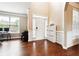 Open foyer featuring gleaming hardwood floors, a side office space, and a bright entrance at 1489 Belmont Hills Dr, Suwanee, GA 30024