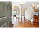 Inviting foyer with hardwood floors, high ceilings, open to the dining room and staircase at 1489 Belmont Hills Dr, Suwanee, GA 30024