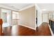 Well-lit hallway with gleaming hardwood floors and white trim, showcasing classic architectural details at 1489 Belmont Hills Dr, Suwanee, GA 30024