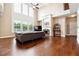 Spacious living room with high ceilings, fireplace, and large windows offering ample natural light at 1489 Belmont Hills Dr, Suwanee, GA 30024