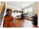 Home office featuring beautiful hardwood floors, large windows and custom built-in shelving at 1489 Belmont Hills Dr, Suwanee, GA 30024