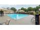 Bright community pool with lounge chairs and umbrellas for relaxing on a sunny day at 1489 Belmont Hills Dr, Suwanee, GA 30024