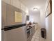 Efficient kitchen design featuring stainless steel appliances, tile flooring, and plenty of cabinet space at 300 Peachtree Ne St # 14H, Atlanta, GA 30308