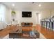 Charming living room featuring hardwood floors, modern decor, and an open layout for easy entertaining at 300 Peachtree Ne St # 14H, Atlanta, GA 30308