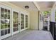 Outdoor balcony with double doors and black metal railings at 311 Peachtree Hills Ne Ave # 13B, Atlanta, GA 30305