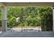 Spacious balcony with iron railings offering scenic views of lush greenery and the surrounding neighborhood at 311 Peachtree Hills Ne Ave # 13B, Atlanta, GA 30305