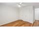 Spacious bedroom features hardwood floors, a ceiling fan, and three closets at 311 Peachtree Hills Ne Ave # 13B, Atlanta, GA 30305