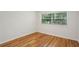 Bedroom with hardwood floors, a window providing natural light, and white walls at 311 Peachtree Hills Ne Ave # 13B, Atlanta, GA 30305