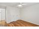 Comfortable bedroom features hardwood floors and three closets at 311 Peachtree Hills Ne Ave # 13B, Atlanta, GA 30305