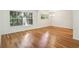 Bright living room featuring hardwood floors, large windows, and plenty of natural light at 311 Peachtree Hills Ne Ave # 13B, Atlanta, GA 30305
