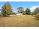 Spacious backyard with some trees and vegetation surrounding the property at 6219 Heardsville Rd, Cumming, GA 30028