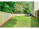 A spacious and enclosed backyard with patio furniture creates a relaxing and private retreat at 6561 Squire Pl, Douglasville, GA 30135