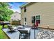 Backyard patio area with outdoor furniture and a charcoal grill near a house at 6561 Squire Pl, Douglasville, GA 30135