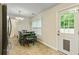 Cozy dining area next to kitchen with stainless steel refrigerator at 6561 Squire Pl, Douglasville, GA 30135